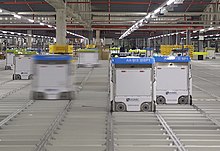 Bots move on the grid inside an Ocado warehouse
