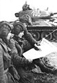 Image 25Soldiers in an East German tank unit reading about the erection of the Berlin Wall in 1961 in Neues Deutschland (from Newspaper)