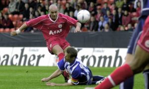 Aberdeen's Roberto Bisconti takes on the Hertha Berlin defence at Pittodrie in September 2002. Image: DC Thomson.