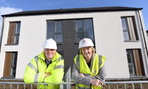 Architect Colin Doig oversees Aberdeen City Council's housebuilding - and showed off new homes at Middlefield to council leader Jenny Laing in 2017. He awaits sentencing after admitting he chased a child with a meat cleaver. Image: Kami Thomson/DC Thomson