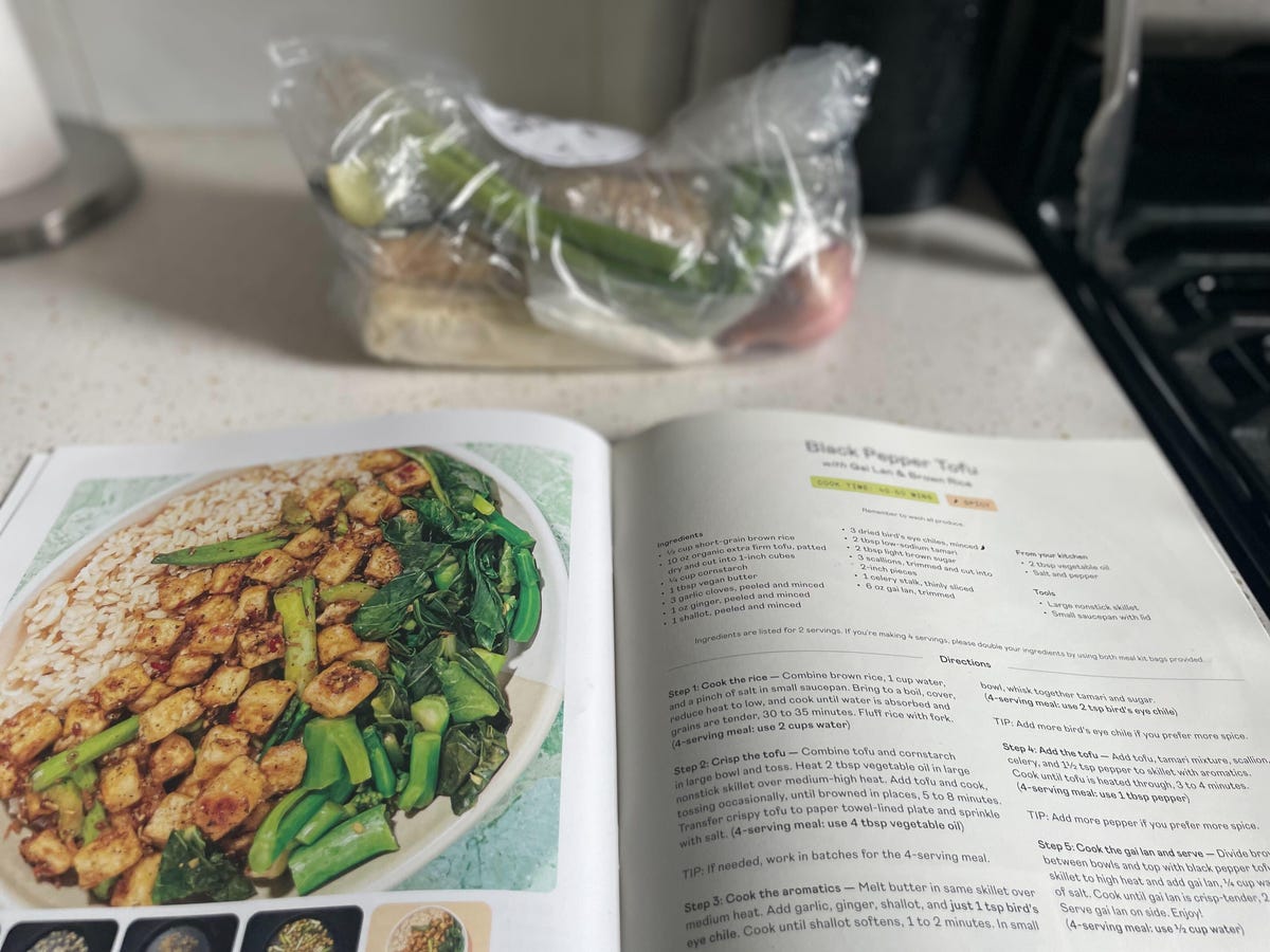 recipe book with ingredients in the background