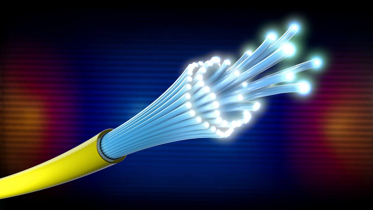 3D illustration of optical light guide cable in yellow with open ends which shine brightly.