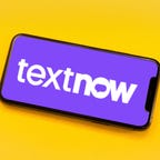 Textnow logo on a phone