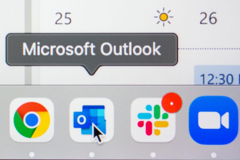 mouse cursor pointing at Outlook icon on a Mac