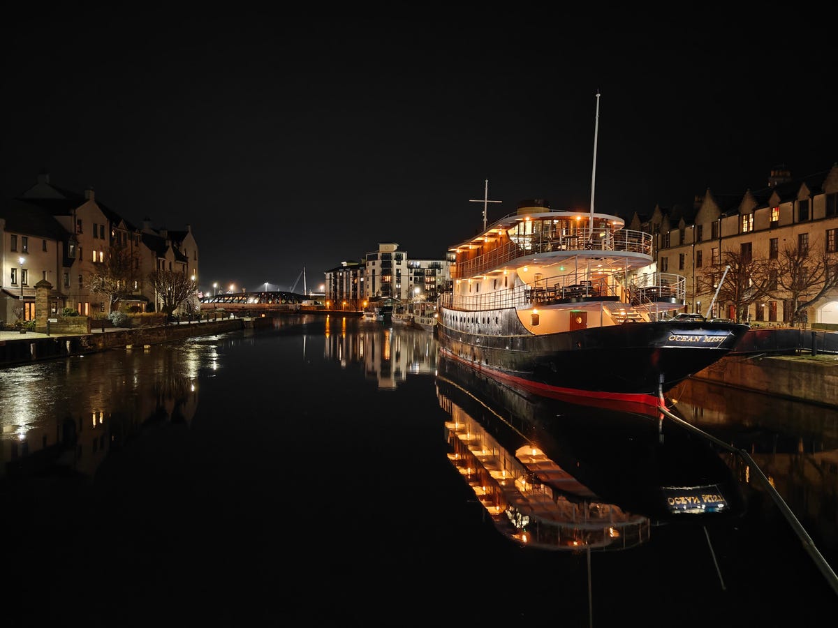 a photo of a boat at night