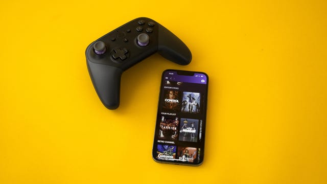 Amazon Luna home screen on the iPhone 13 Pro with the Luna controller above it