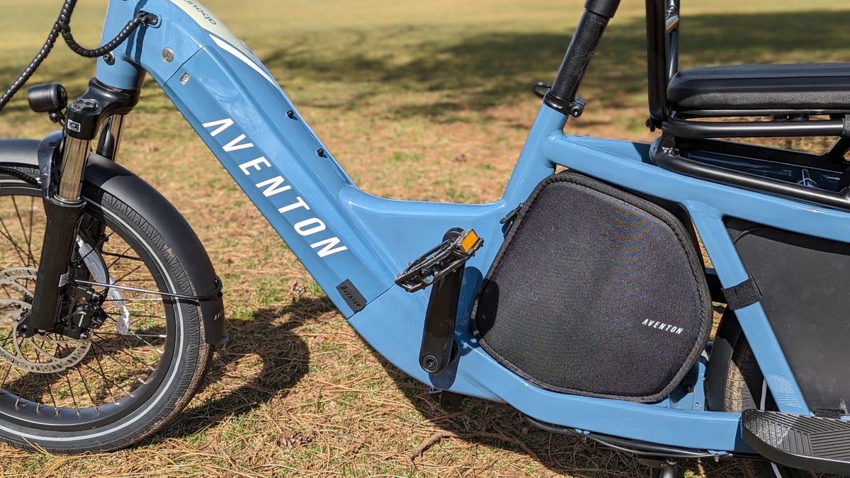 Aventon Abound cargo e-bike's integrated battery and storage case in its blue frame.