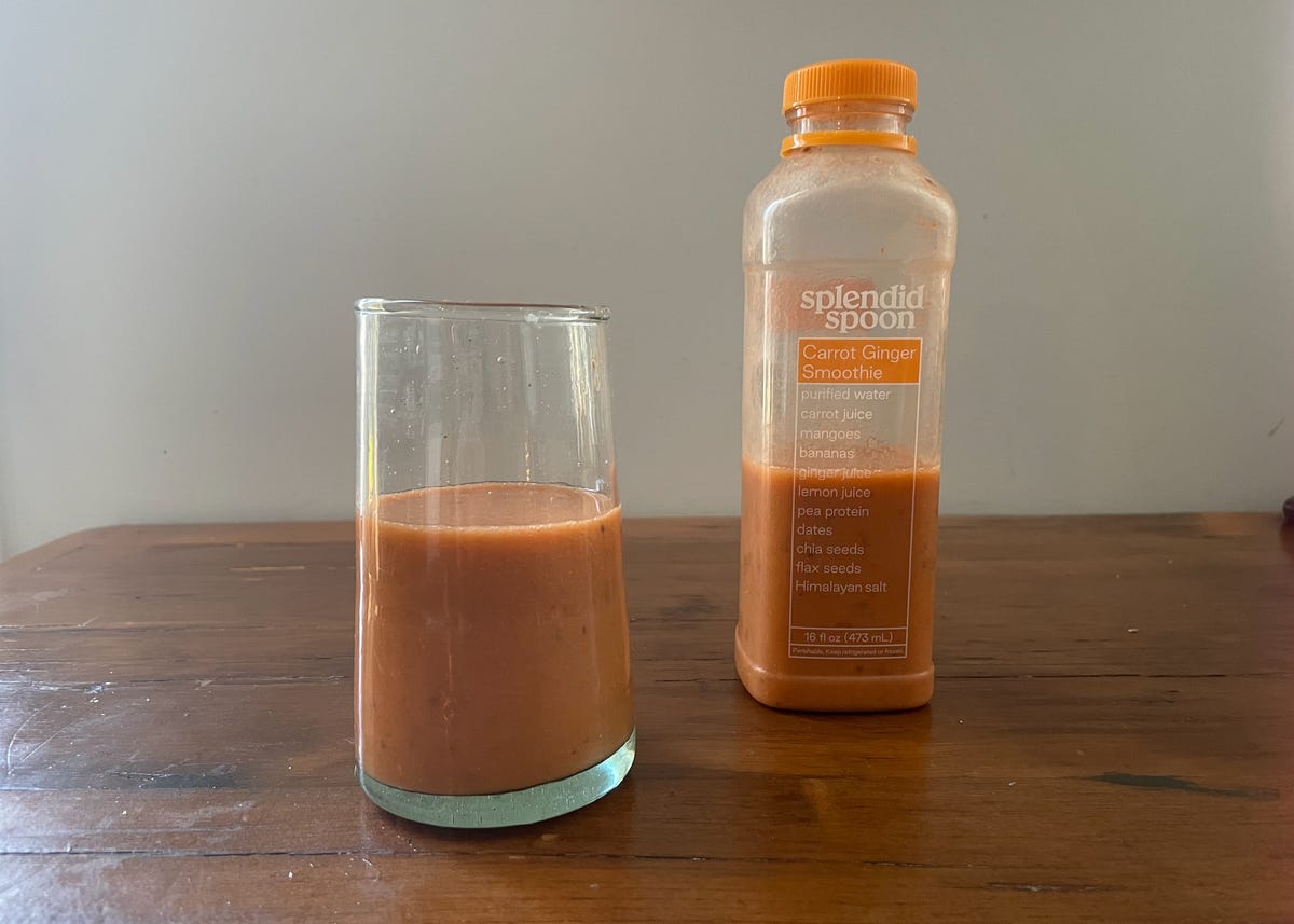 carrot ginger smoothie next to glass