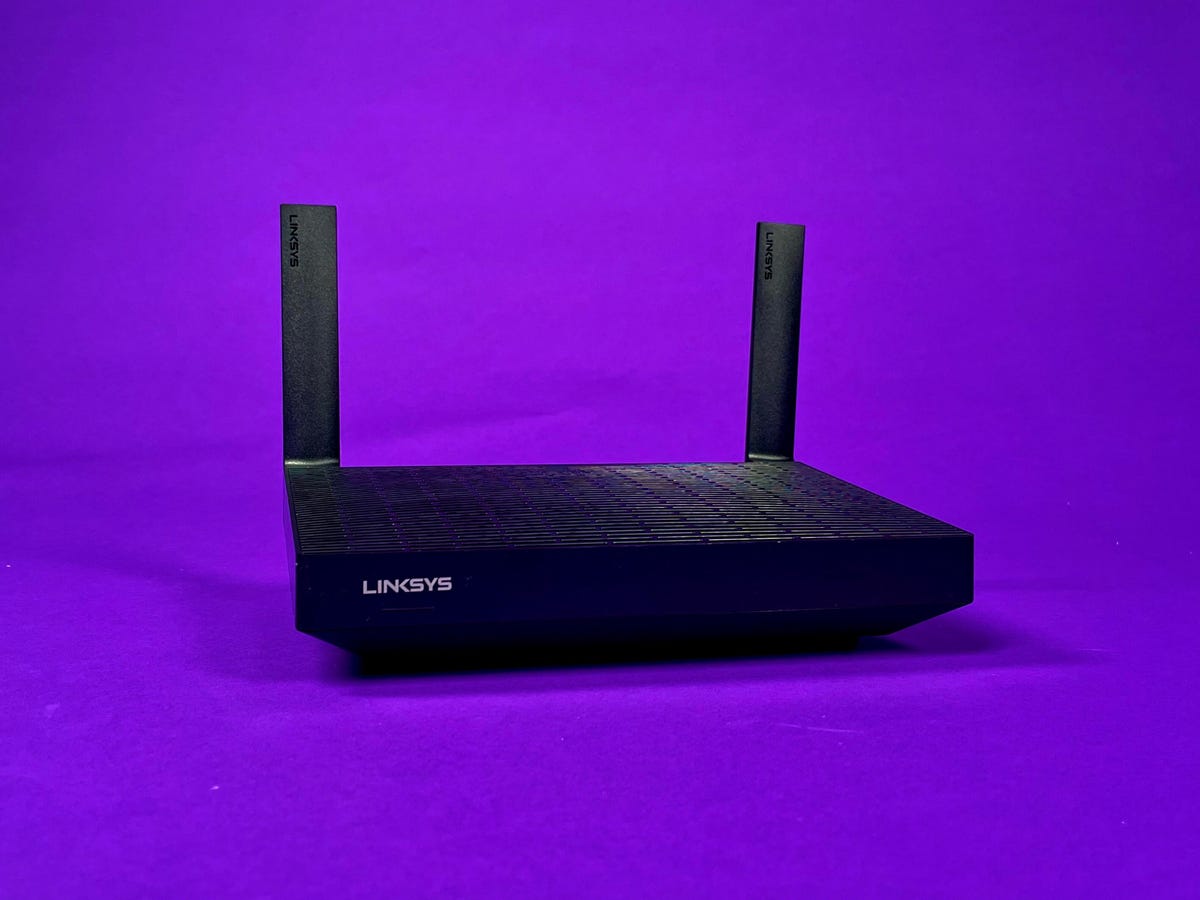 Linksys Hydra Pro 6 router on a purple background