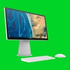 An HP desktop PC, keyboard and mouse against a green background