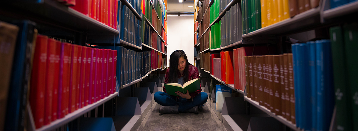 student in the library, BOOKWORM, taken by Josue Mendez, Baruch College