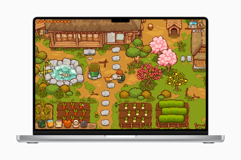 Una imagen del juego Japanese Rural Life Adventure en una MacBook Pro muestra un personaje y un perro en un jardín en un estilo pixelado.