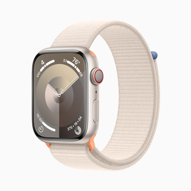 The starlight aluminium Apple Watch Series 9 with a stardust Sport Loop.