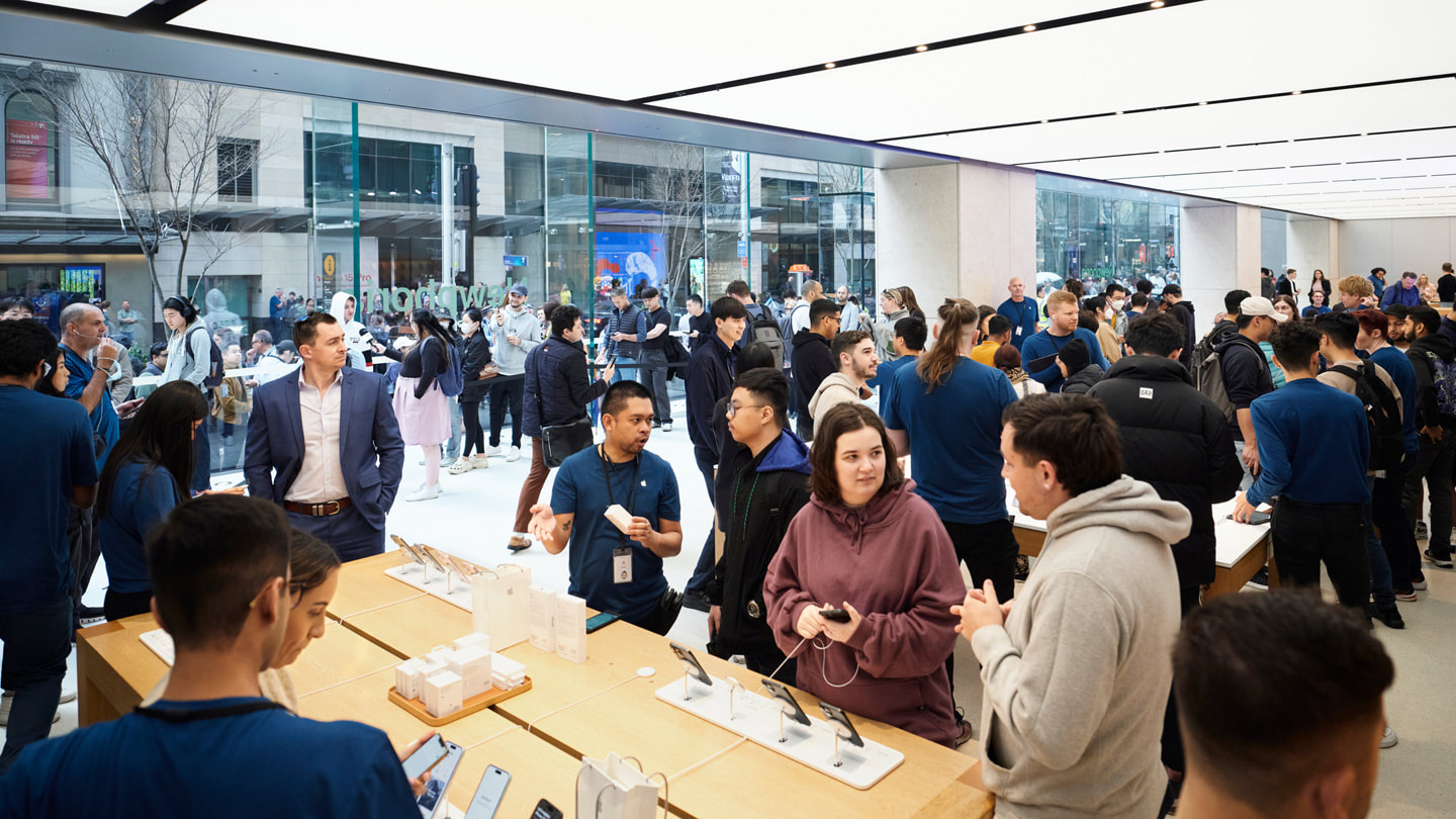 Team members and customers inside Apple Sydney, Australia.