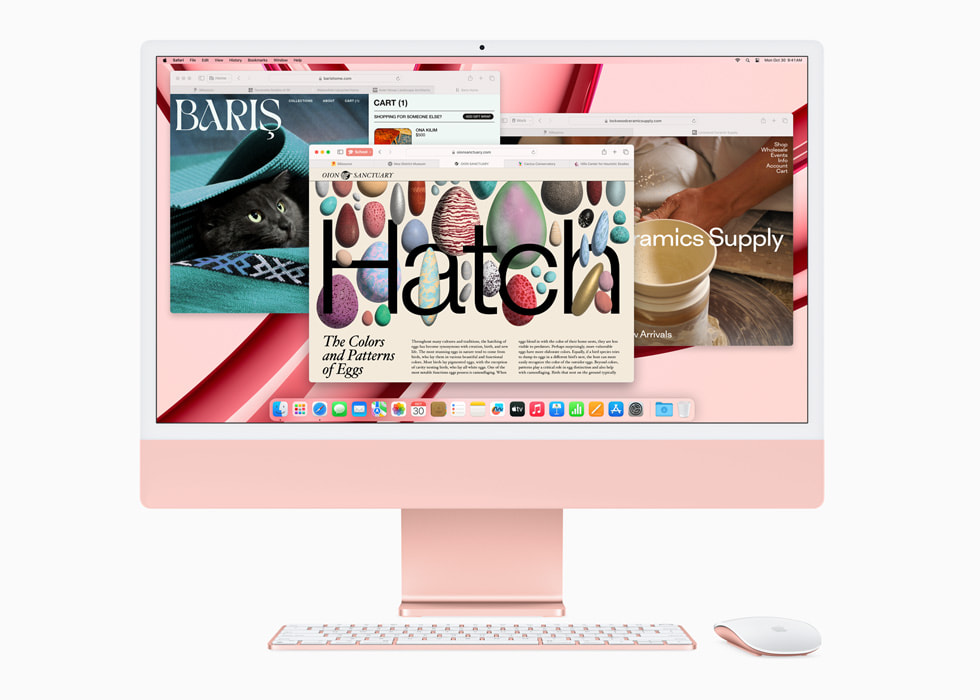 Safari를 보여주는 M3 칩을 장착한 새로운 핑크 색상의 iMac과 컬러 매칭 키보드 및 마우스.