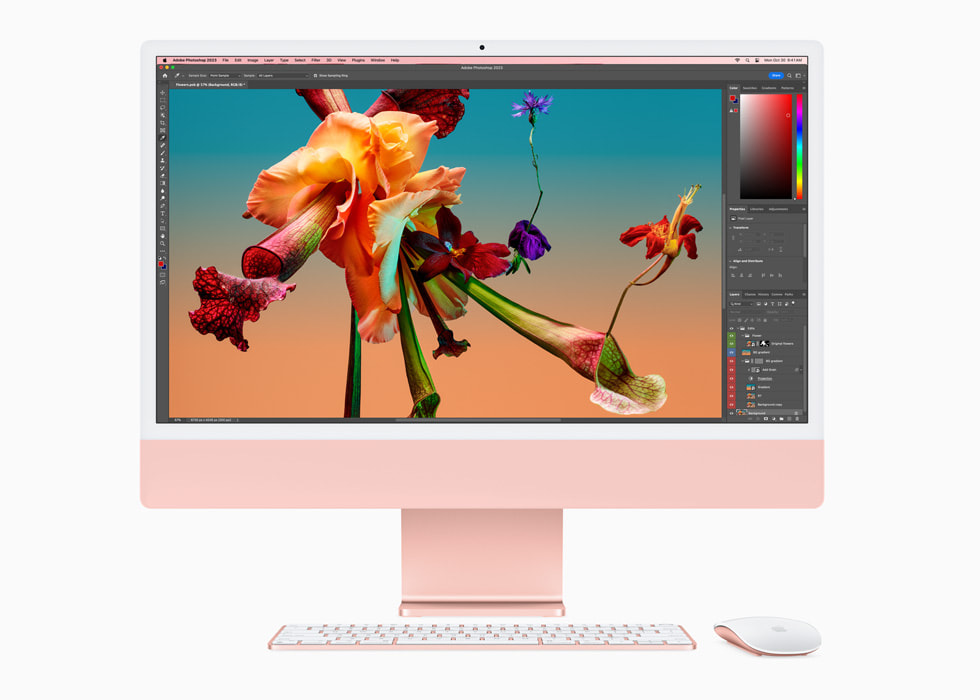 Adobe Photoshop을 보여주는 M3 칩을 장착한 새로운 핑크 색상의 iMac과 컬러 매칭 키보드 및 마우스.