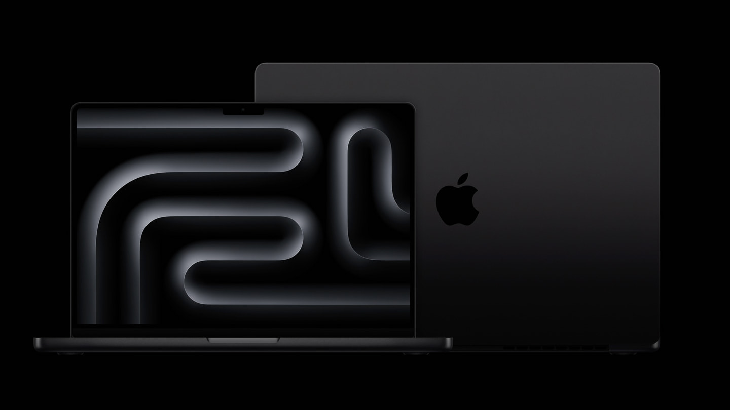 Dos portátiles MacBook Pro, uno visto de frente y el otro visto por detrás, sobre un fondo negro.