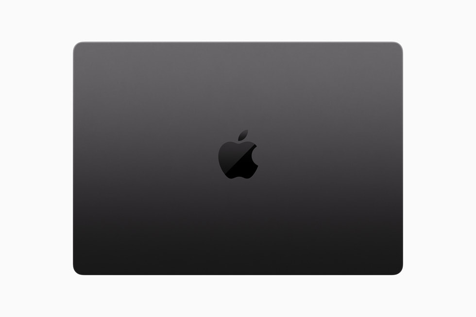 Vista cenital de una MacBook Pro cerrada sobre un fondo blanco.