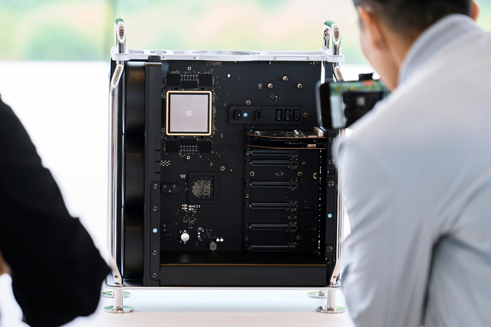 An attendee examines the new Mac Pro featuring M2 Ultra.