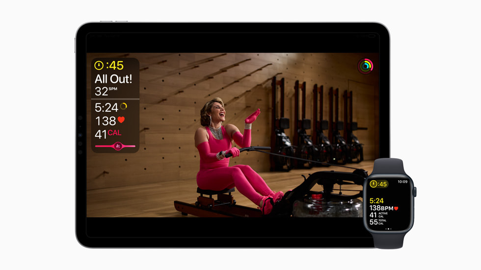 Un iPad Pro 11 pouces et une Apple Watch montrent un entraînement de rameur avec la coach Anja Garcia portant une tenue inspirée de Madonna.