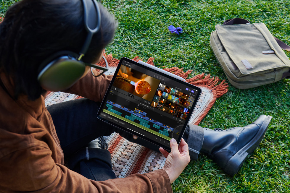 A person drawing in Final Cut Pro on iPad outdoors.