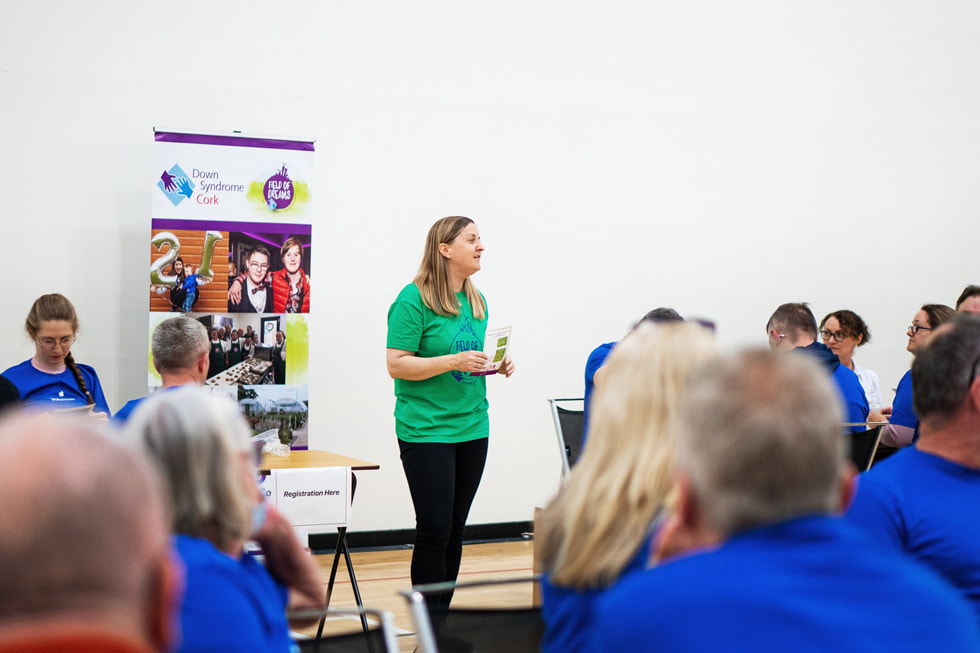 An Apple volunteer speaks before a group at Field of Dreams in Cork, Ireland.