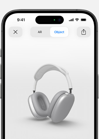 Kuva hopeanvärisistä AirPods Max ‑kuulokkeista lisätyn todellisuuden näkymässä iPhonessa.