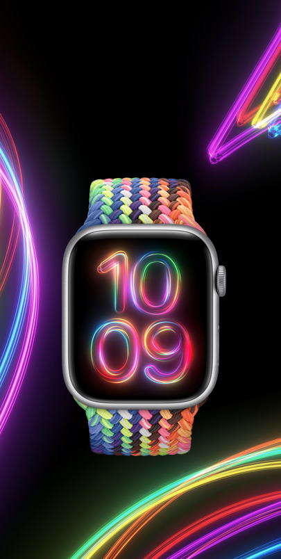 Yeni çok renkli neon Pride Edition Örgü Solo Loop ve onunla uyumlu Pride Işığı saat kadranıyla bir Apple Watch Series 9.