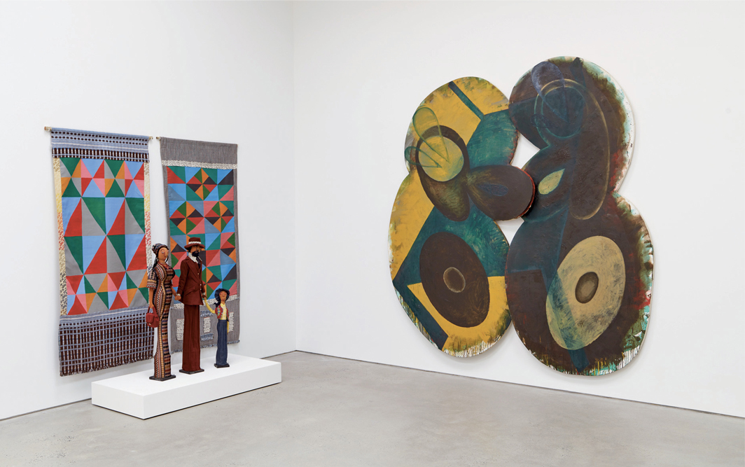View of “Painting in New York: 1971–83,” 2022. From left: Faith Ringgold, Windows of the Wedding #16: Lovers, 1974; Faith Ringgold, Juanita, Eddie and Caron, 1973; Elizabeth Murray, Table Turning, 1982–83.