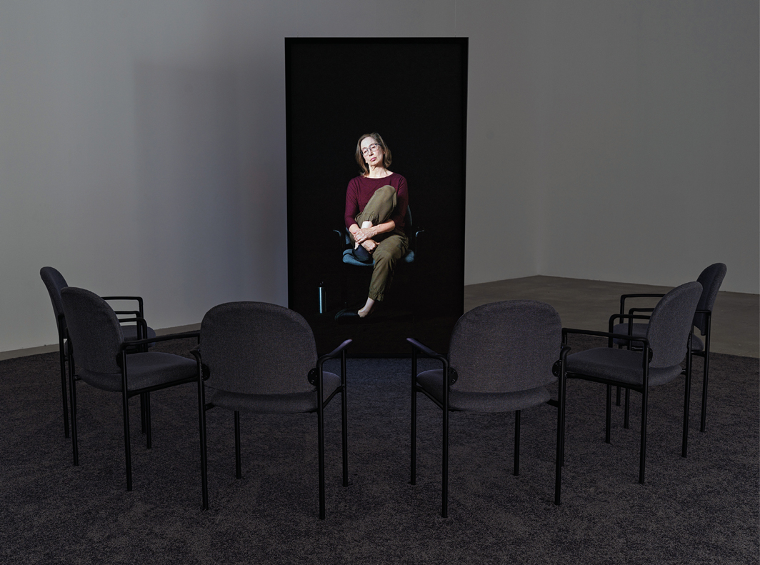 Andrea Fraser, This meeting is being recorded, 2021, UHD video installation (color, sound, 99 minutes), six chairs. Photo: Alex Yudzon.
