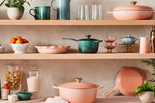 Cookware by Le Creuset in New PÃªche Color on open shelving in kitchen