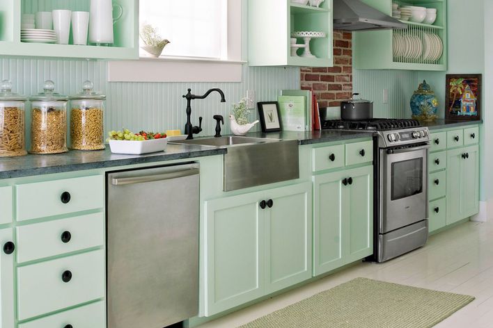 seafoam pastel green kitchen with brick wall and vintage decor