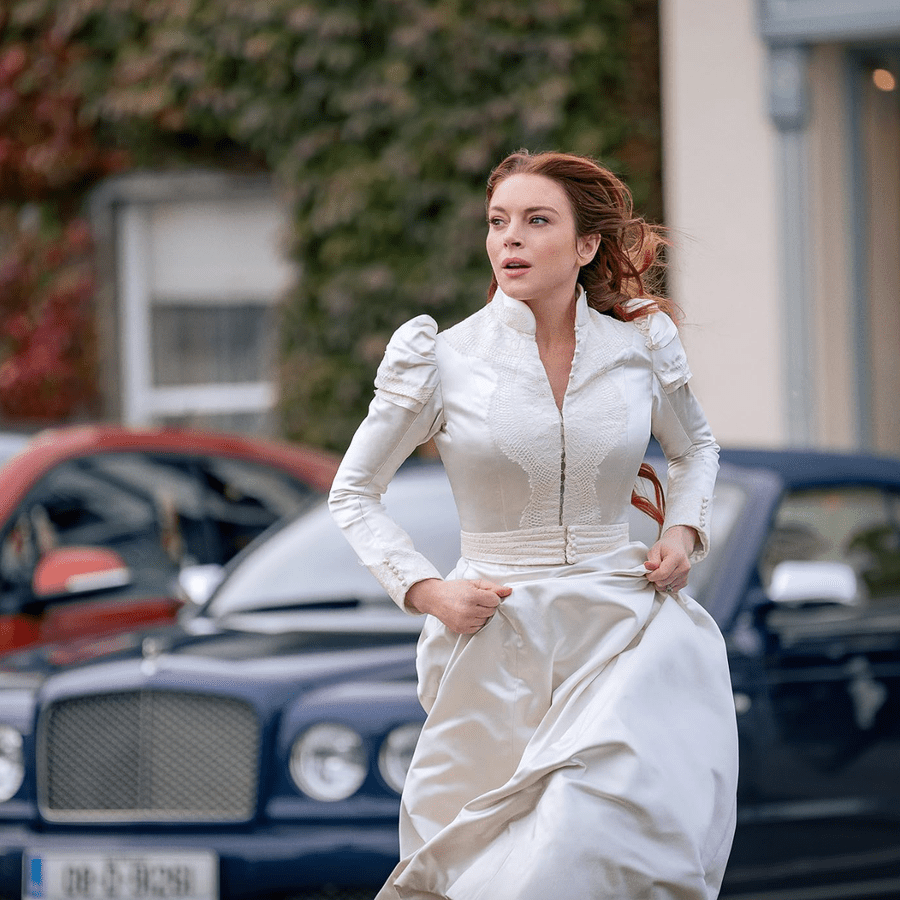 Lindsay Lohan running in a wedding dress