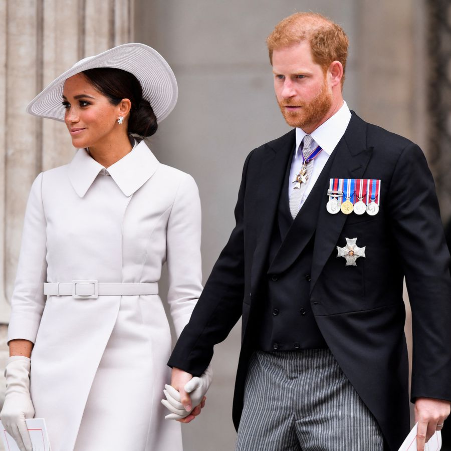 Meghan Markle and Prince Harry holding hands outside of St. Paulâs Cathedral for Queen Elizabeth IIâs 2022 jubilee