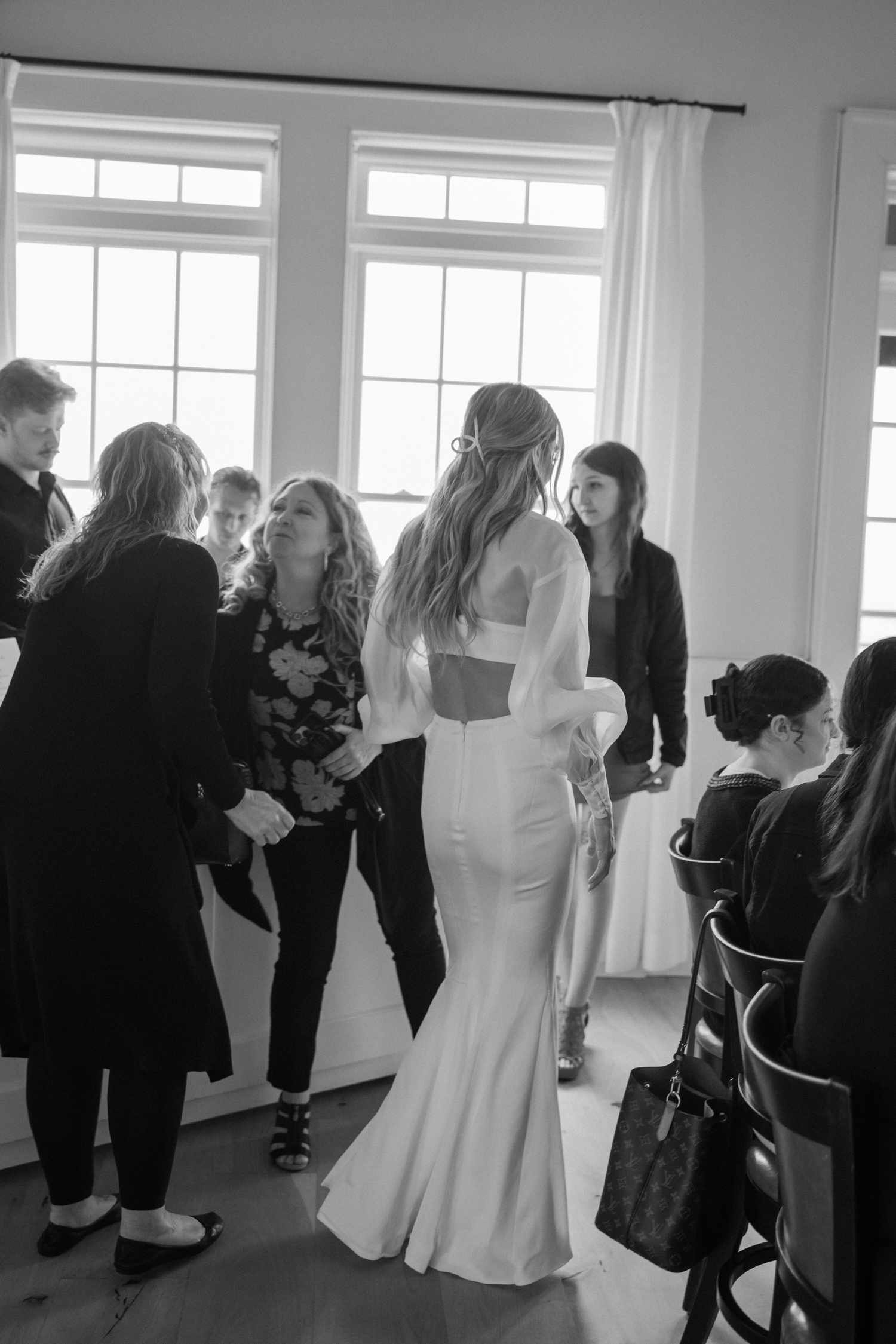 Black and White Portrait of Bride Greeting Guests at Bridal Shower