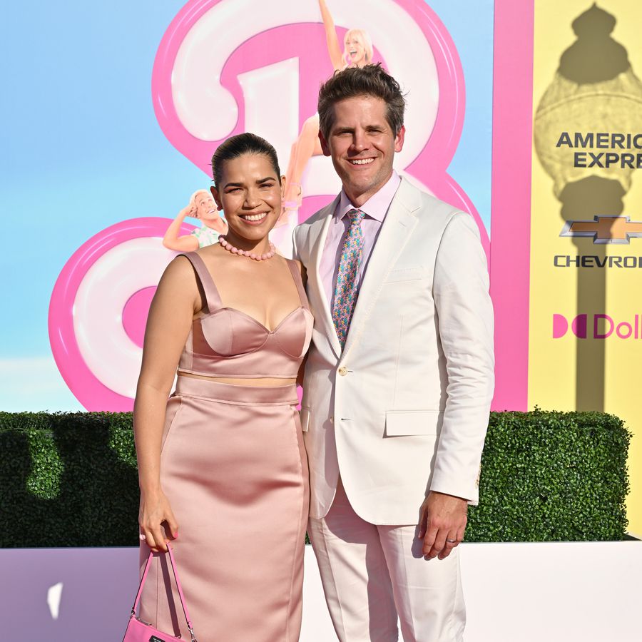 America Ferrera and Ryan Piers Williams pose on a pink carpet for the Barbie movie world premiere