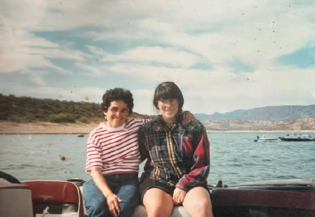 A photograph of Dr. Bernal and her niece sitting on a boat on a lake. 