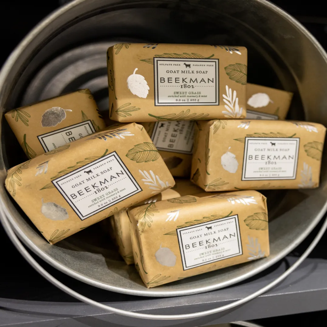 A bucket full of Beekman 1802 bars of soap for sale.