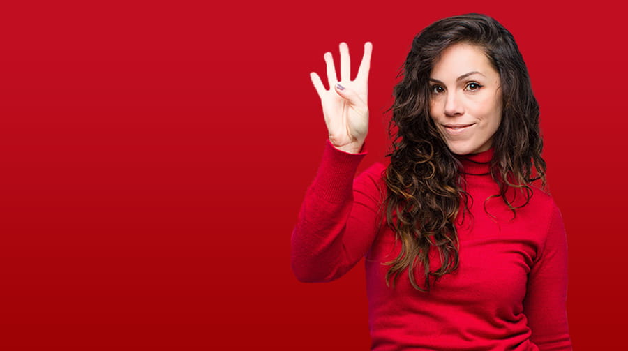 Woman holding up four fingers with red background