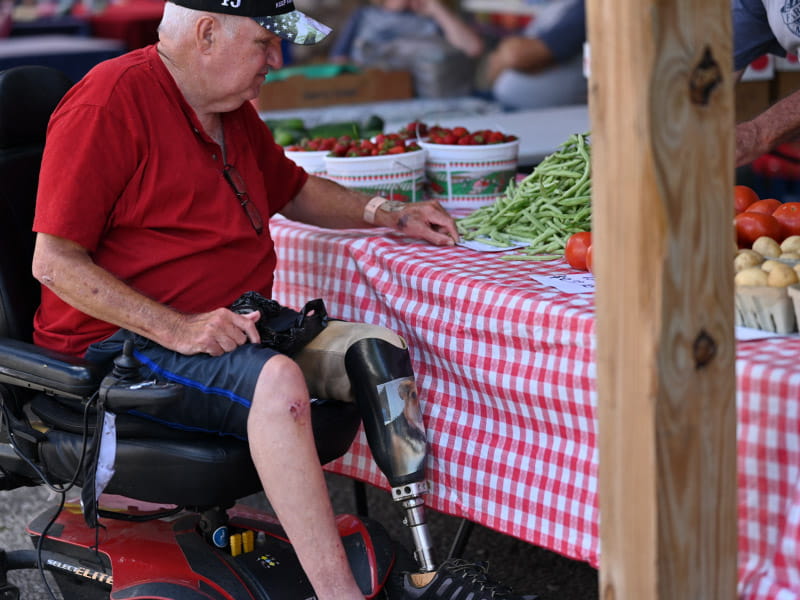 Heart disease and diabetes survivor Lyle Marcum regularly visits the farmers market run by the Williamson Health and Wellness Center. (Photo by Walter Johnson Jr./American Heart Association)