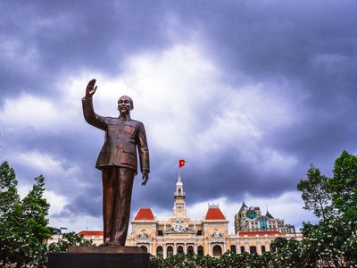 The statue of Ho Chi Minh in Ho Chi Minh City. In the background the town hall building