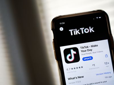 Close-up of a phone that someone is holding with the TikTok app being shown in the App Store