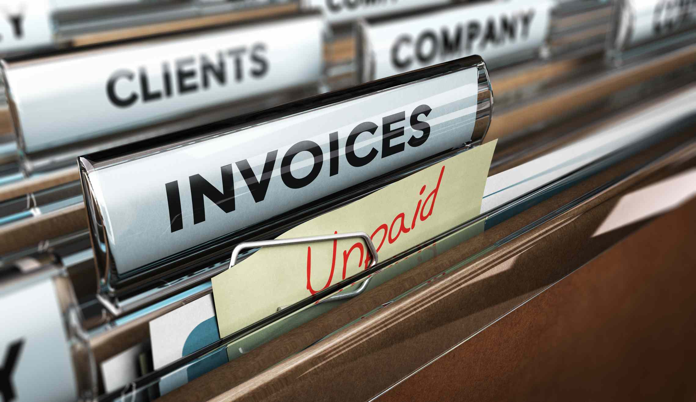 A file of invoices with an "unpaid" tab