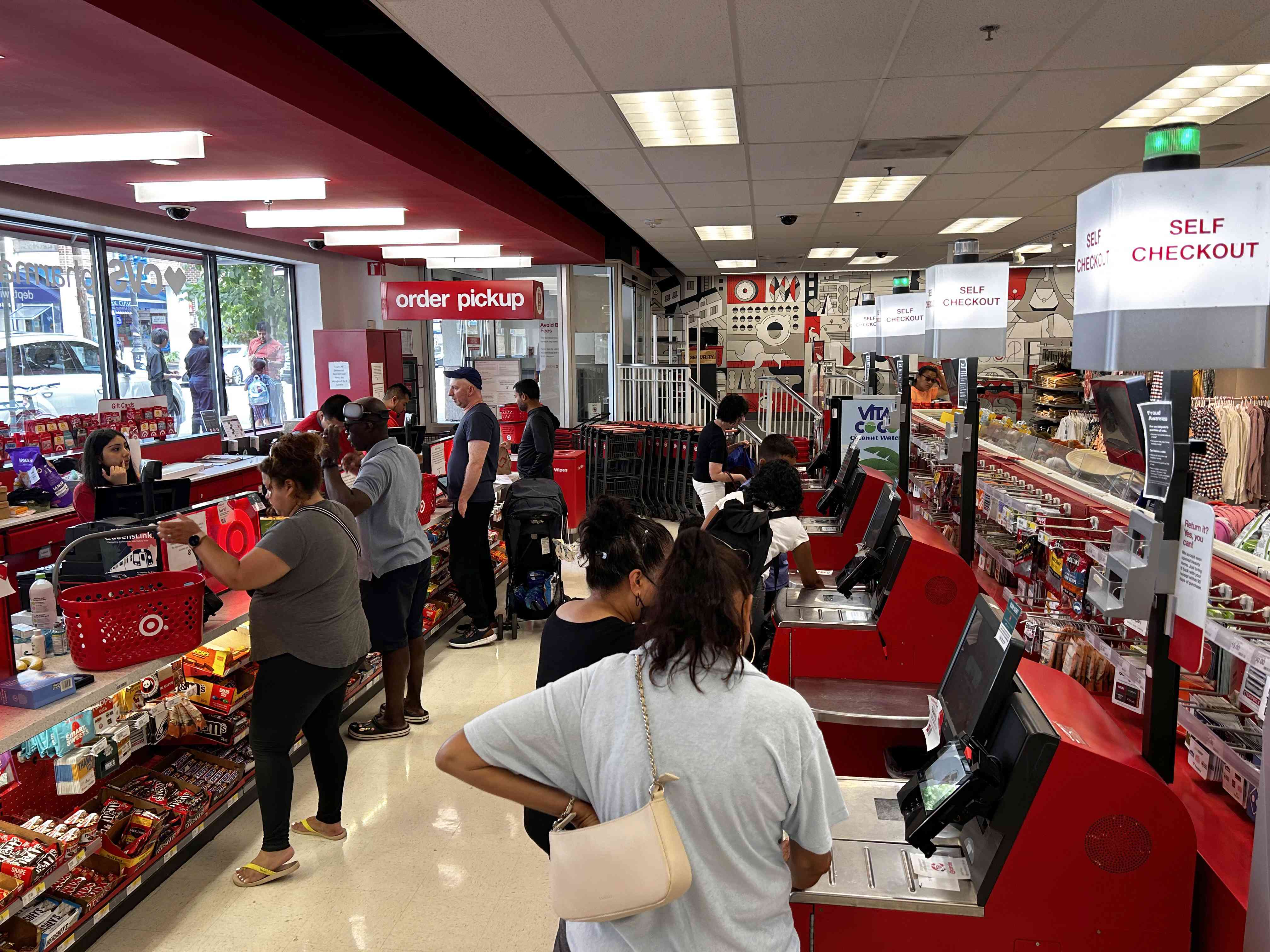 Busy Self checkout vs busy cashier check out at Target Store, Queens, New York.