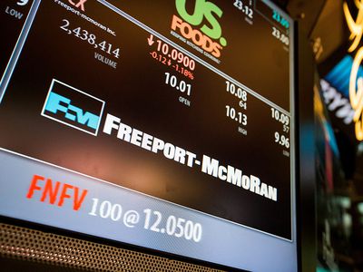 Freeport-McMoRan Inc. signage is displayed on a monitor on the floor of the New York Stock Exchange (NYSE) in New York, U.S., on Friday, Oct. 21, 2016.