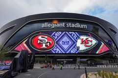 A video board displaying images for Kansas City Chiefs and San Francisco 49ers