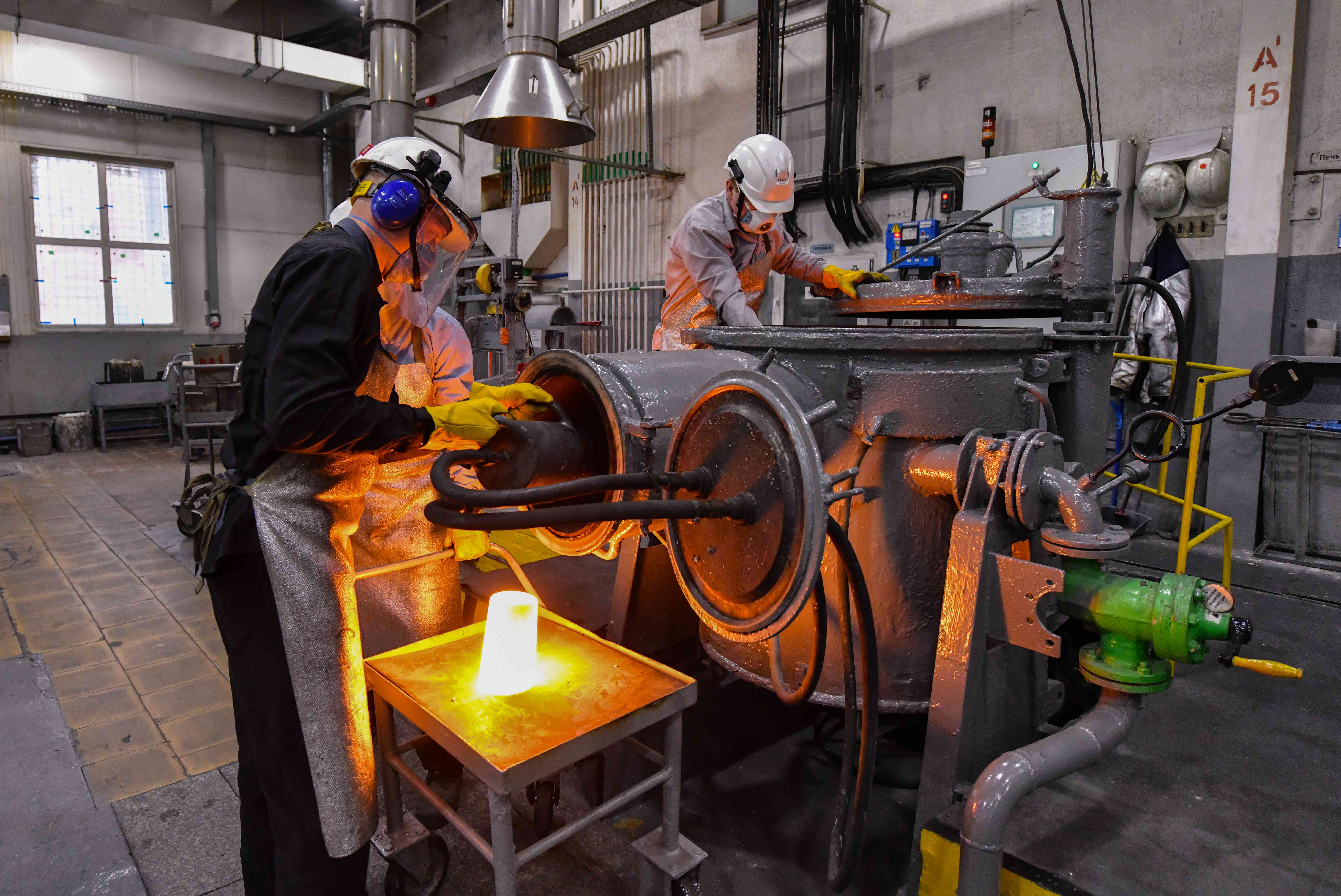 Workers in a factory crafting platinum