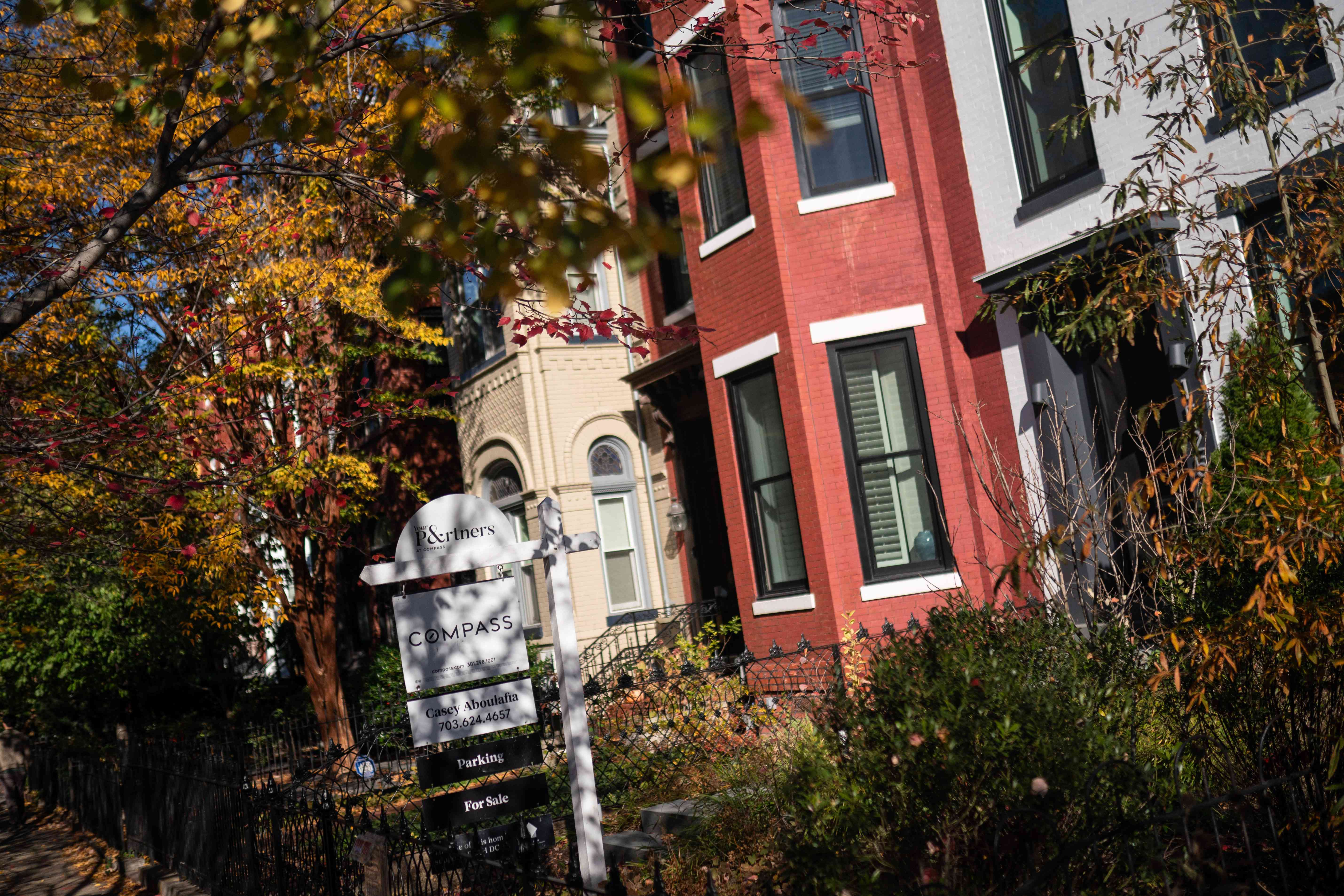 A "For Sale" sign outside of a home in Washington, DC, US, on Sunday, Nov. 19, 2023. The National Association of Realtors is scheduled to release existing homes sales figures on November 21. 