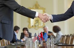 Businessmen Shaking Hands in Meeting