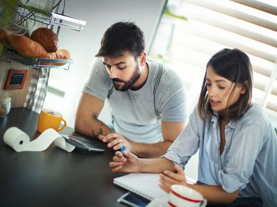 Couple reviewing debts